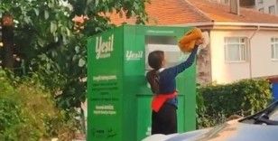 Canlarını hiçe sayarak giysi kumbarasından kıyafet çaldılar
